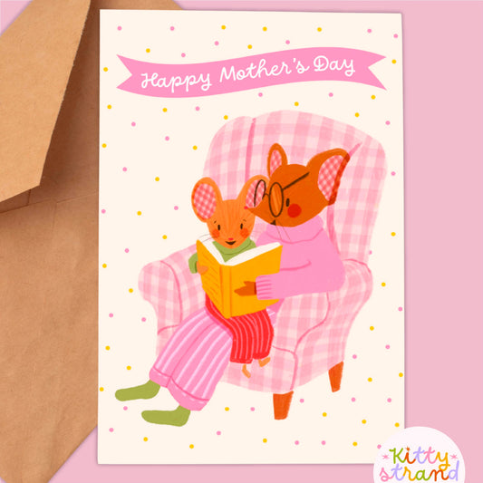 Sweet Mother's day card with an illustration of a mother mouse and baby mouse reading a book together in a gingham armchair