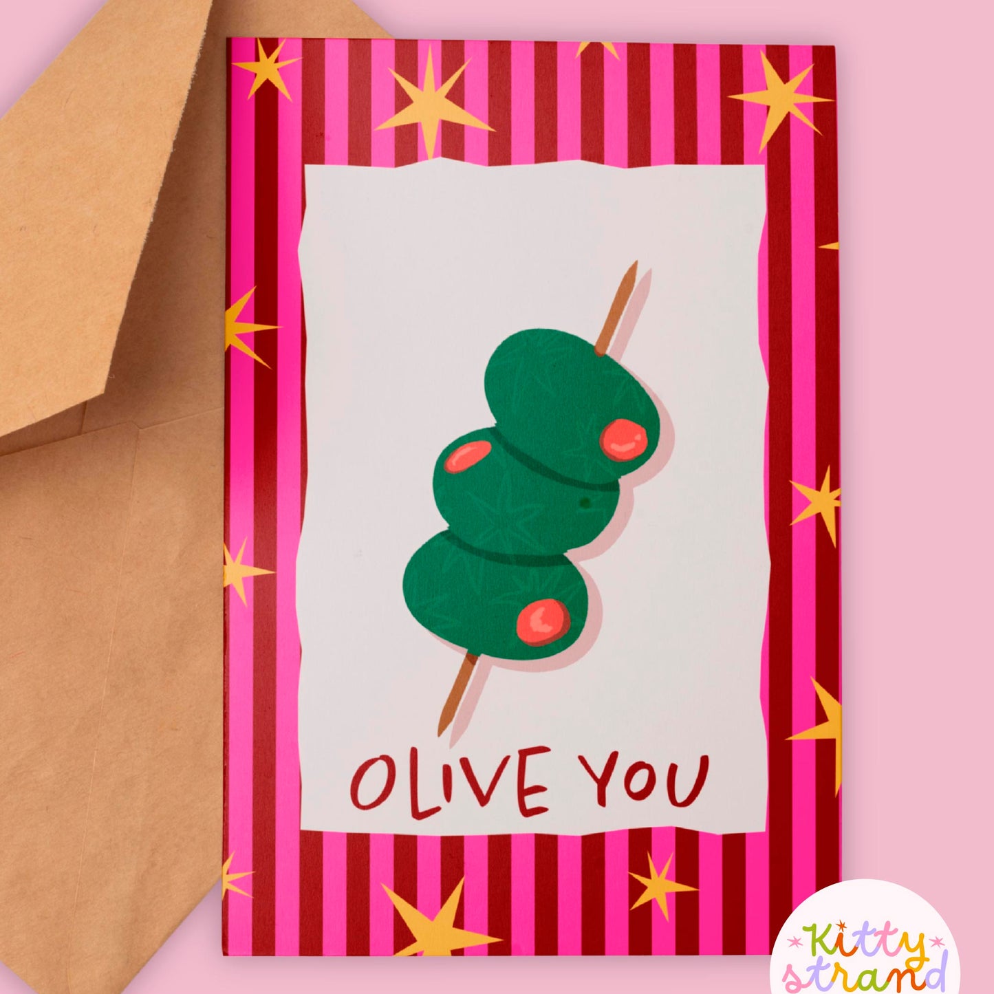 Greeting card with olive design and 'OLIVE YOU' text on a striped background, featuring a brown envelope.