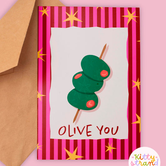 Greeting card with olive design and 'OLIVE YOU' text on a striped background, featuring a brown envelope.