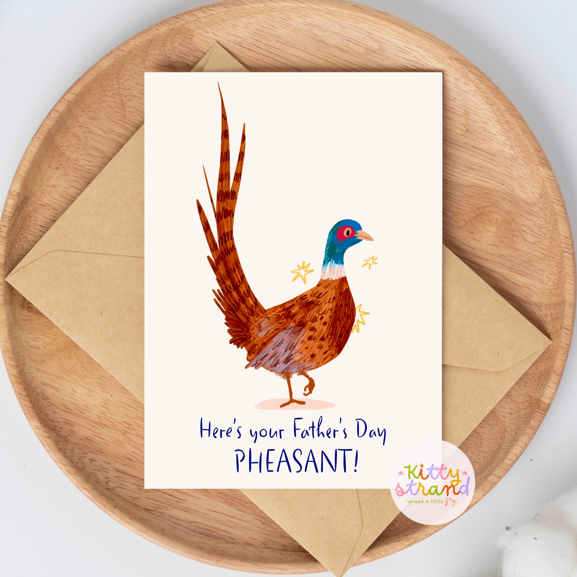 Father's Day card with a pheasant illustration on a wooden plate with an envelope.