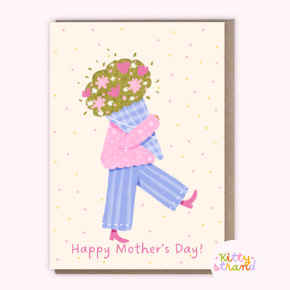 Mother's Day card with a illustration of a woman holding flowers and the text 'Happy Mother's Day!' by Kitty Strand.