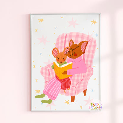 wall art with an illustration of two mice reading a book in a checkered chair with a pink background. Children's book inspired wall decor