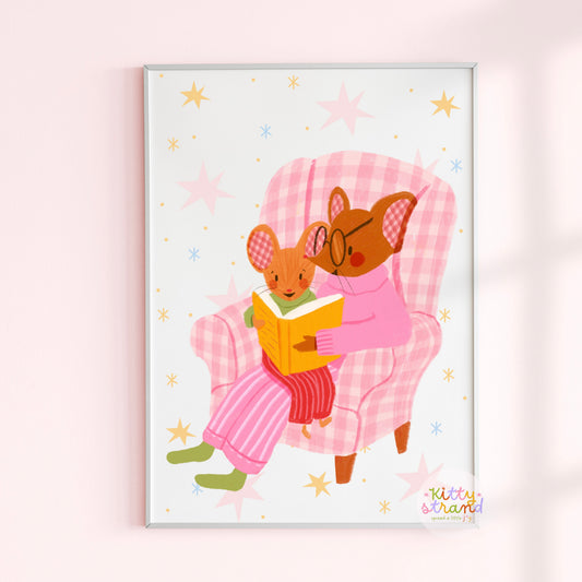 wall art with an illustration of two mice reading a book in a checkered chair with a pink background. Children's book inspired wall decor