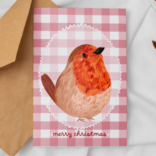 Greeting card with a robin design and 'merry christmas' text against a soft red gingham background 