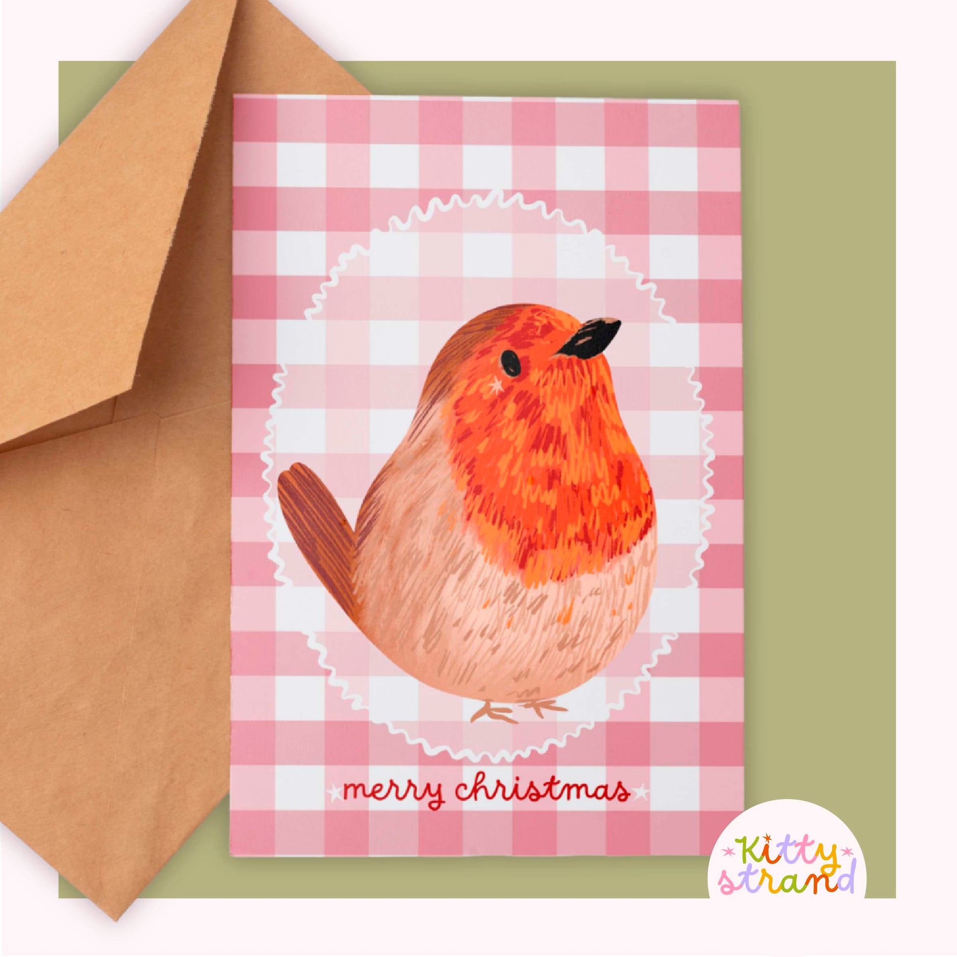 Greeting card with a robin design and 'merry christmas' text against a soft red gingham background 
