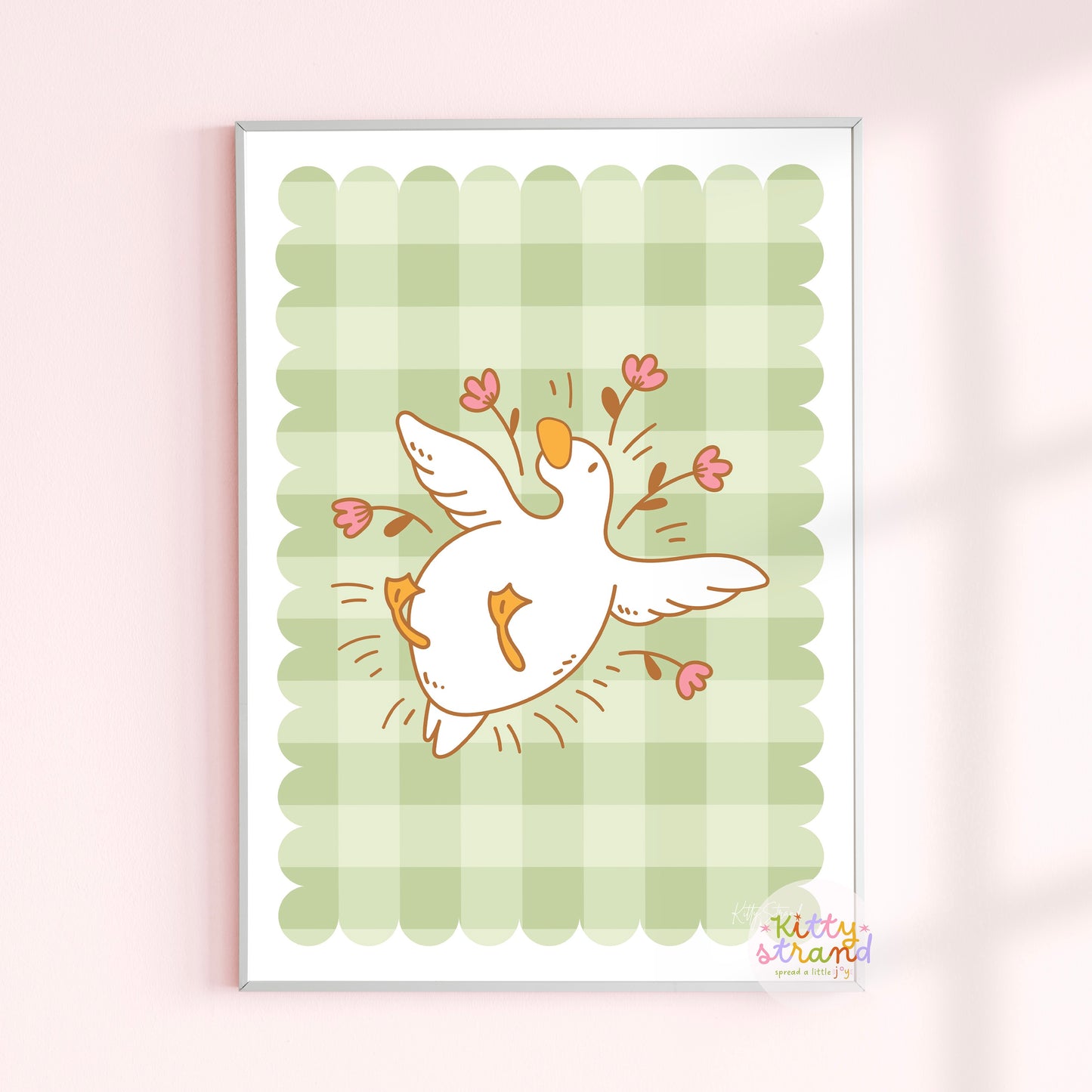 gingham wall art with an illustration of a duck / goose laying surrounded by flowers 