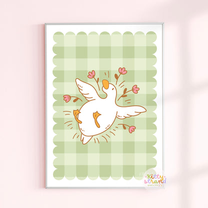gingham wall art with an illustration of a duck / goose laying surrounded by flowers 