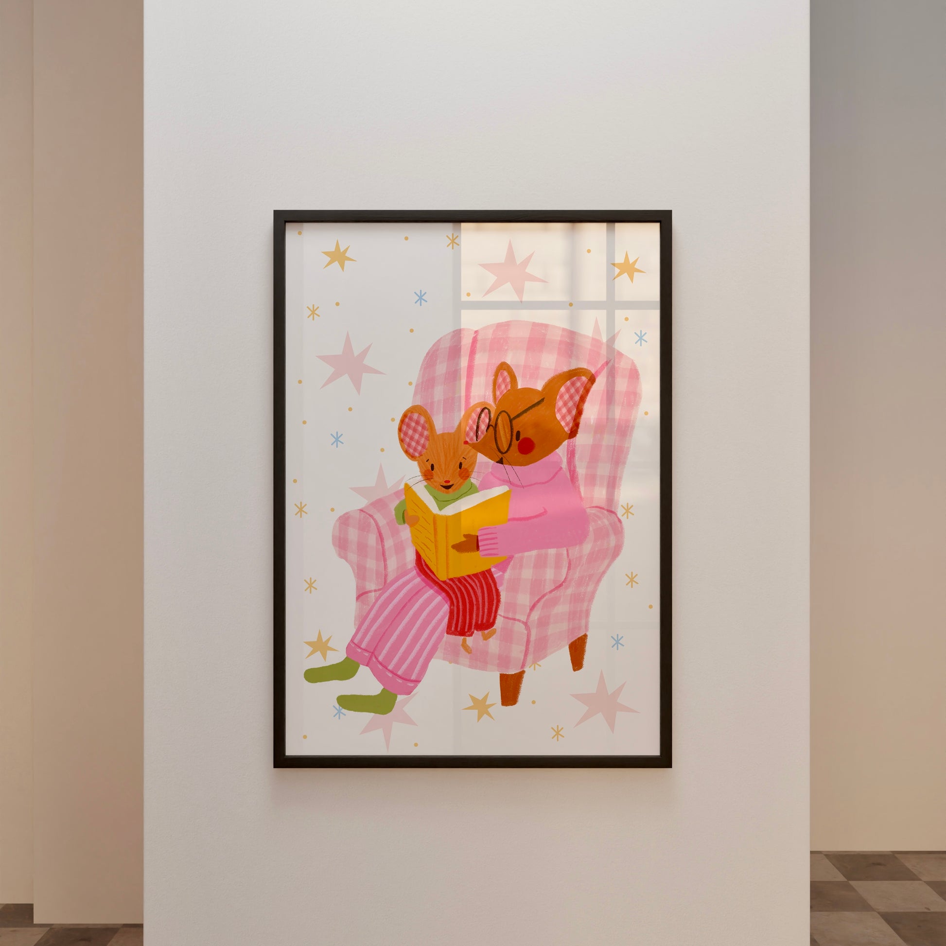 wall art with an illustration of two mice reading a book in a checkered chair with a pink background. Children's book inspired wall decor