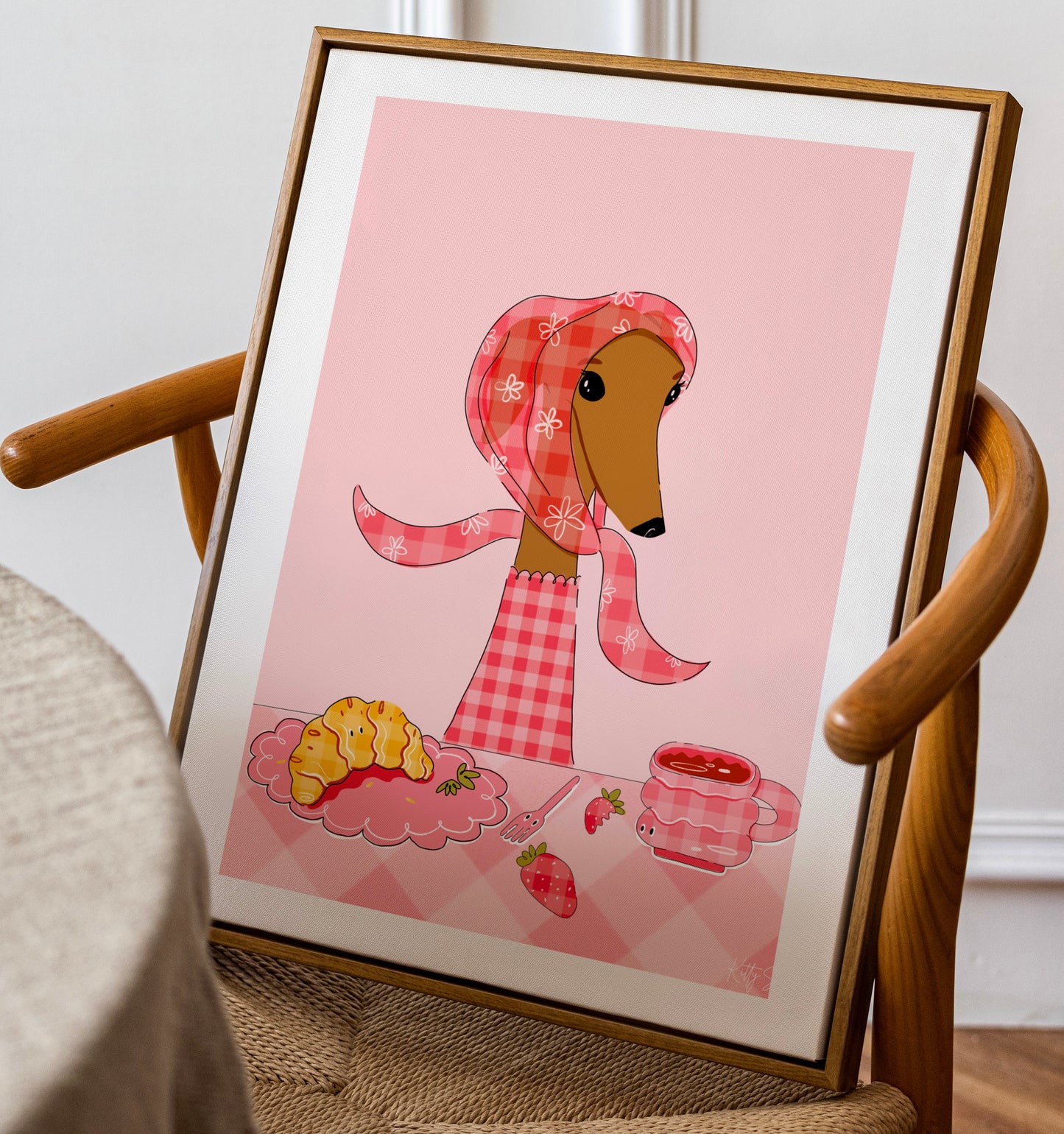 Framed illustration of a dog in a checkered outfit on a chair