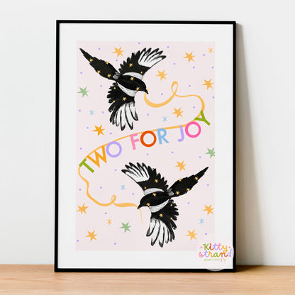 Framed artwork with two magpie illustrations and colorful text on a light background