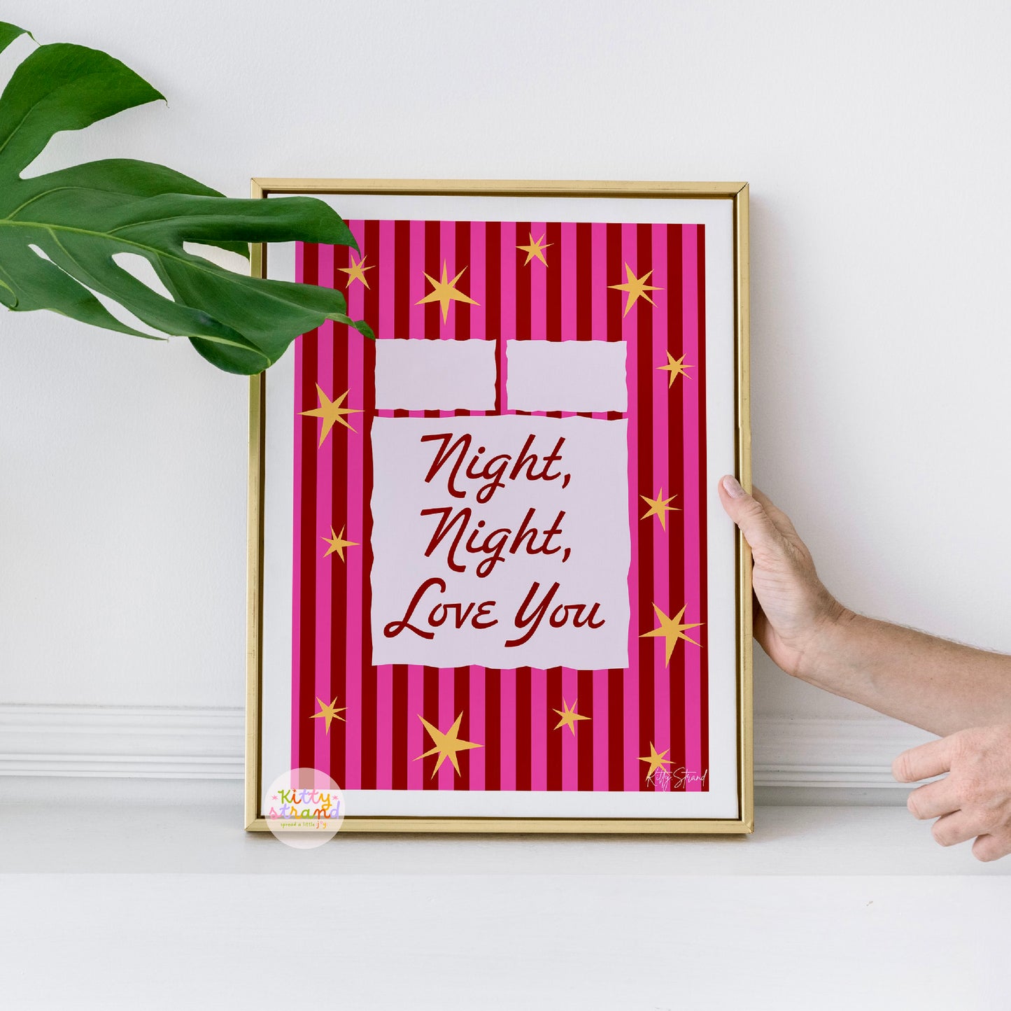 Framed artwork with 'Night, Night, Love You' text on a red striped background.