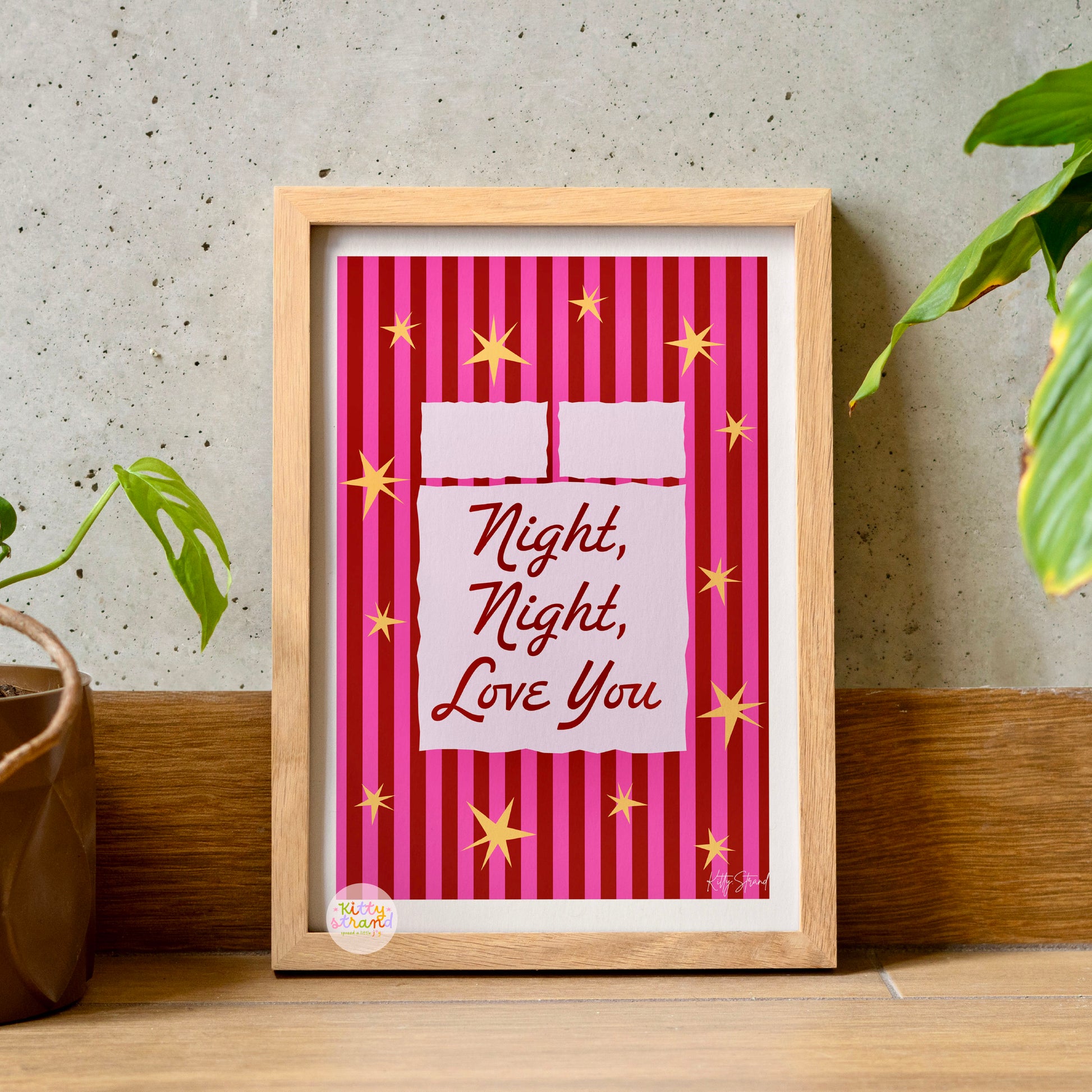 Framed artwork with 'Night, Night, Love You' text on a pink striped background.