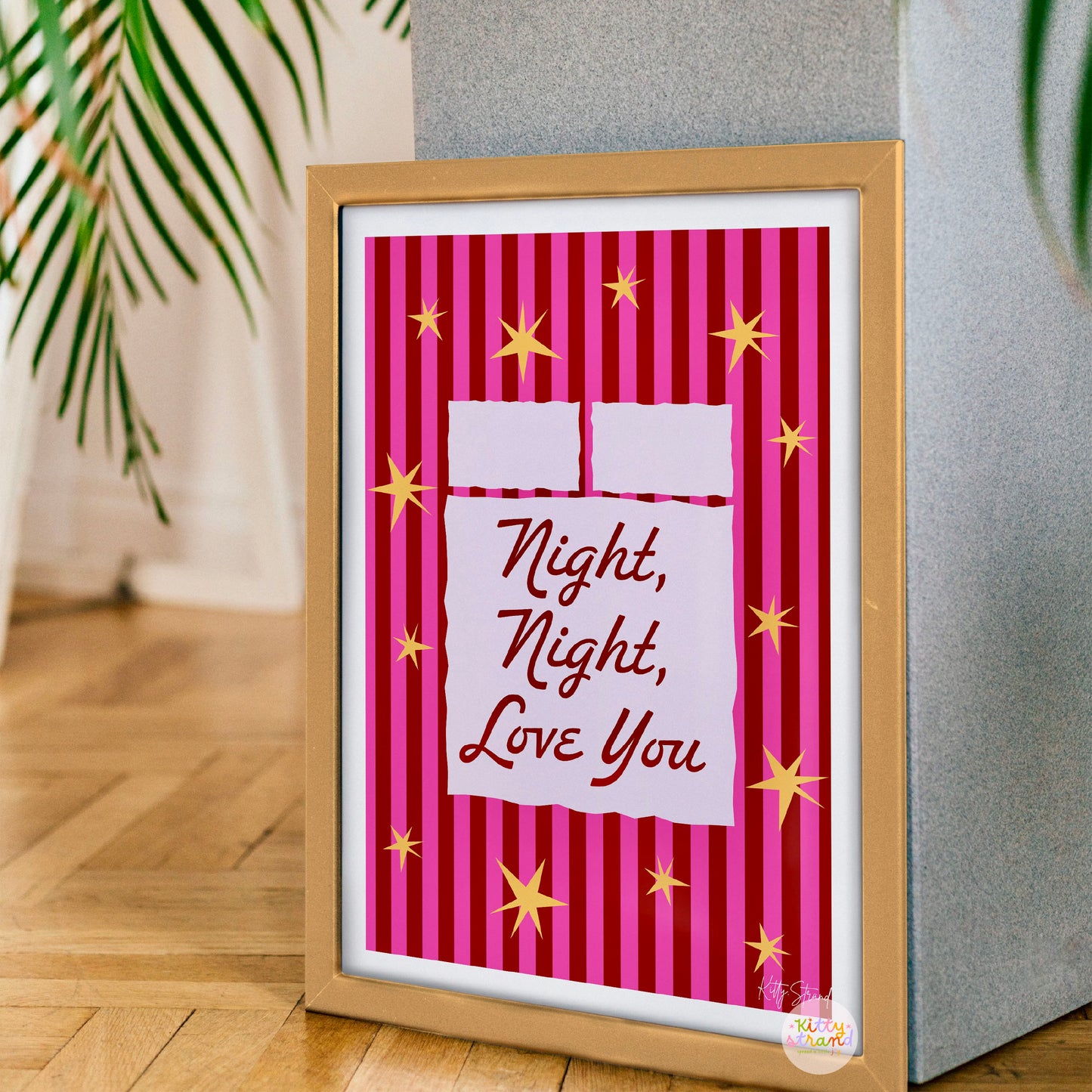 Framed artwork with 'Night, Night, Love You' text on a striped background