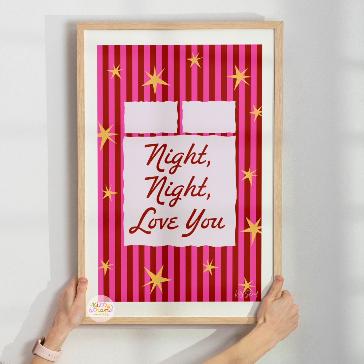 Framed artwork with 'Night, Night, Love You' text on a striped background